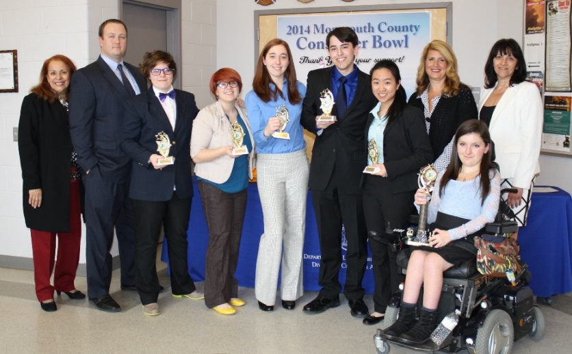 Freehold Township High School wins the Monmouth County Consumer Bowl on Wednesday, March 19, 2014 in Howell, NJ. Pictured left to right: Margaret Anastos, Consumer Bowl Director, NJ Division of Consumer Affairs, Freehold Township Consumer Bowl team advisor Dan Cooper, team members Joanne D'Avella, Samantha Sanchez, Samantha Fitzgerald, Michael Milo and Bethany Mo, Freeholder Serena DiMaso, team member Anna Landre and Annmarie Howley, director of the Monmouth County Division of Consumer Affairs. 
